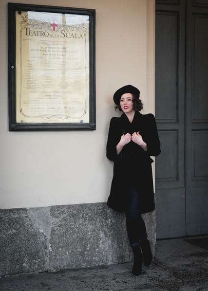 Lisette Oropesa in front of Teatro alla Scala in Giorgio Armani jacket, top and beret